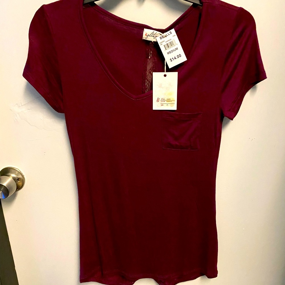 NEW WITH TAGS Ladies top. Size medium . Non smoking home. Lace up the back
